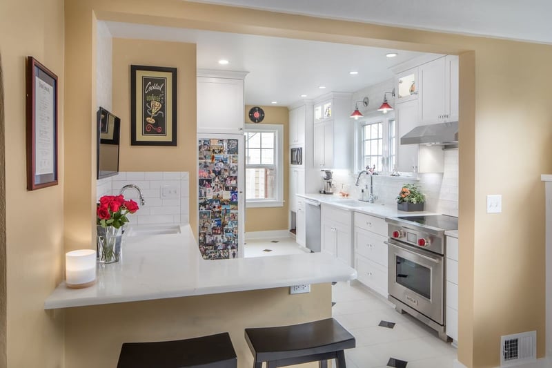 kitchen remodel with white counters and yellow walls in Salem Oregon by Kraft Custom Construction